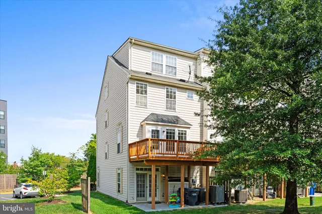 a front view of a building with a garden