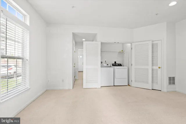 a view of a big room with windows and cabinet