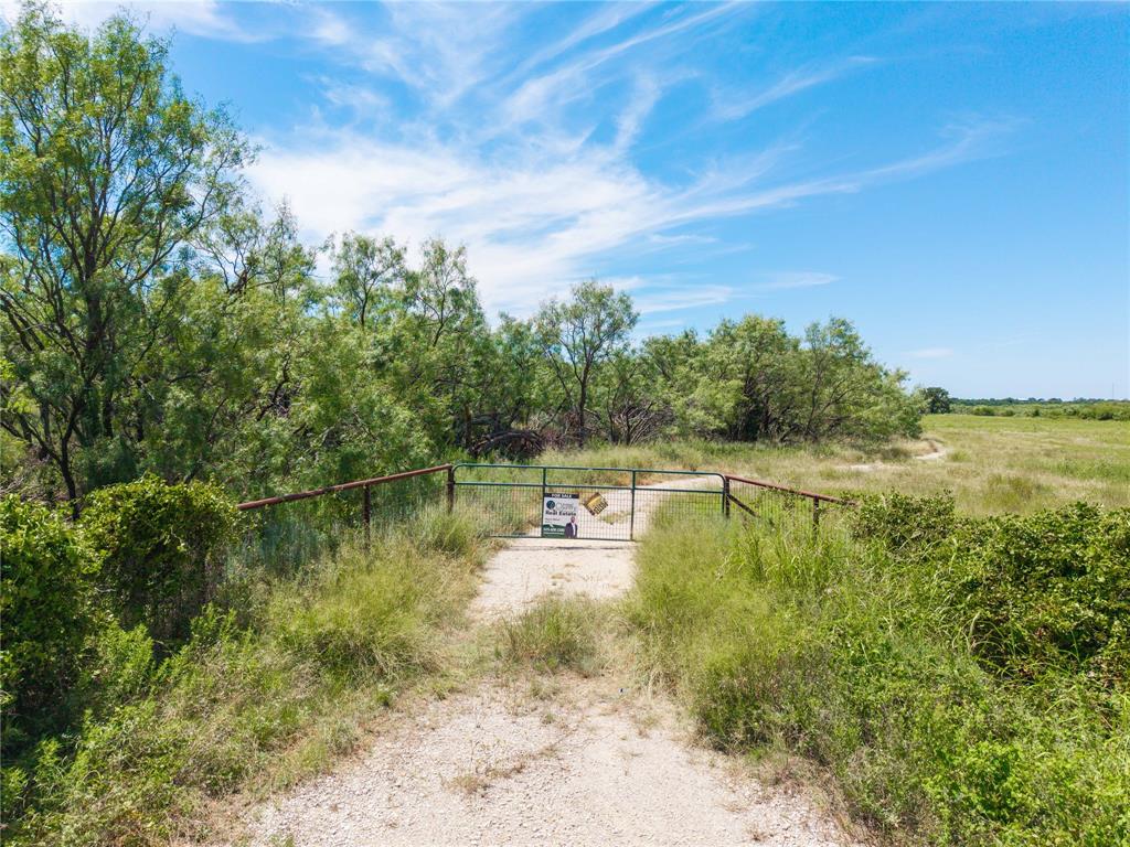 1689 Fm May, TX 76857 - Photo 22 of 28 a view of a water pond with green yard