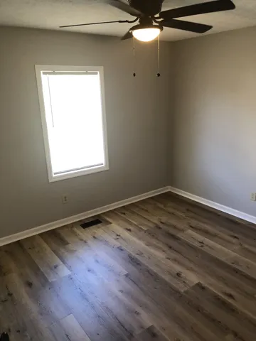 a kitchen with granite countertop a stove and a sink