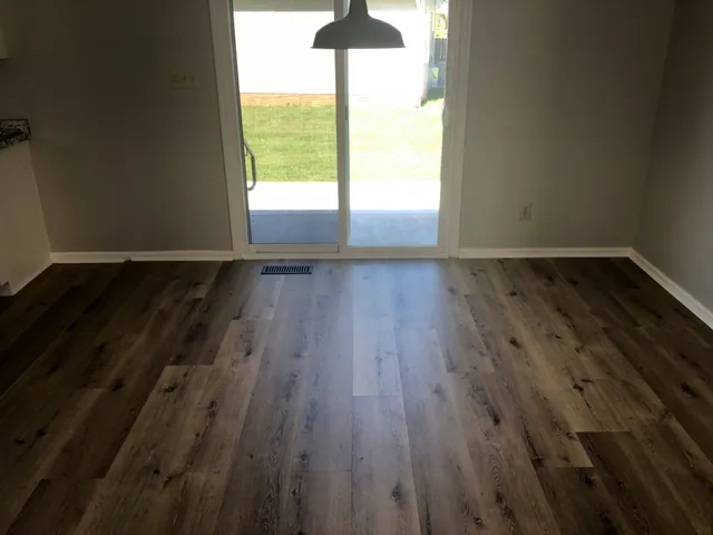 a backyard of a house with yard and outdoor seating