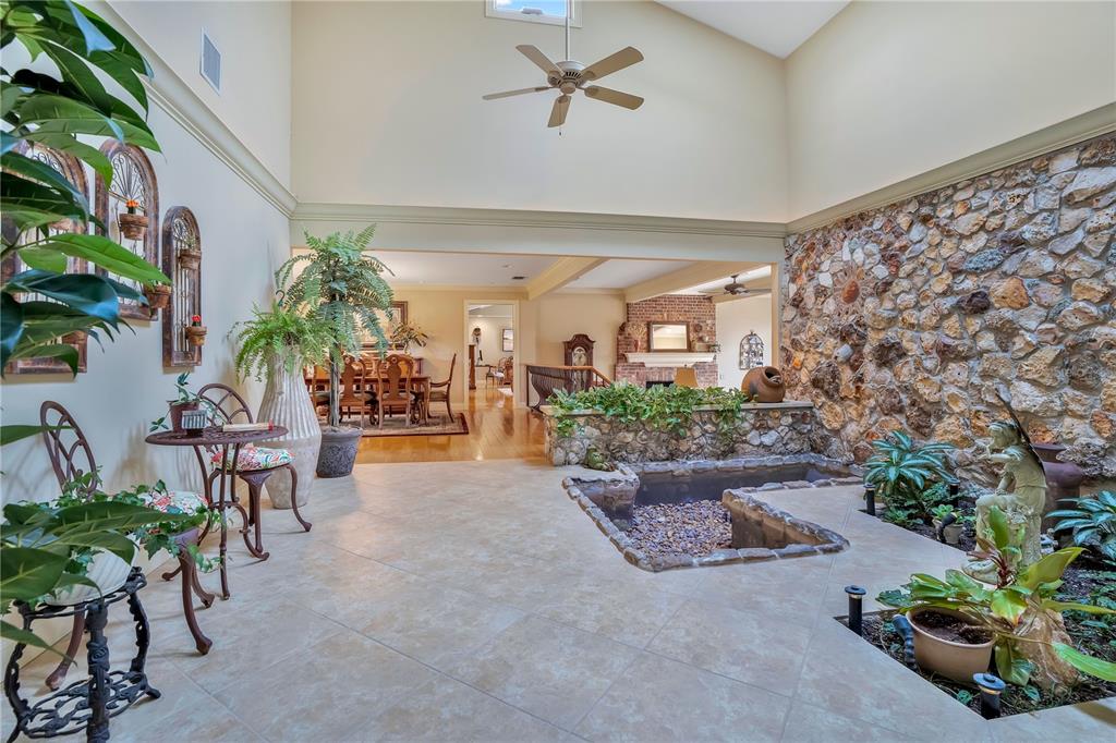 11450 Fangorn Road Orlando, FL 32825 - Photo 13 of 58 a living room with furniture and a chandelier