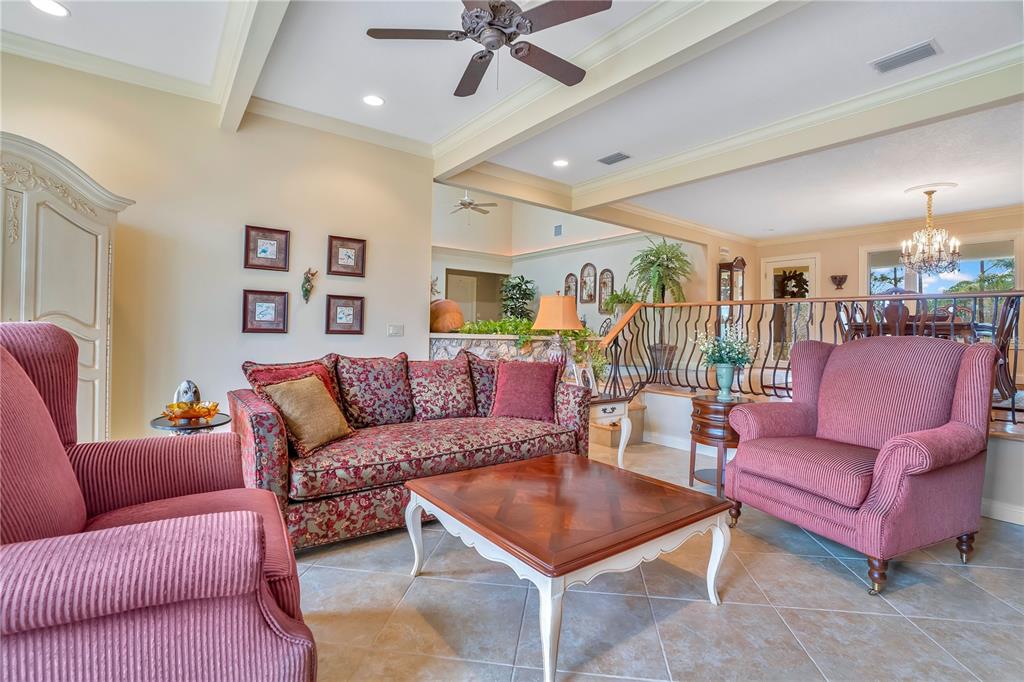 11450 Fangorn Road Orlando, FL 32825 - Photo 16 of 58 a living room with furniture a rug and a ceiling fan