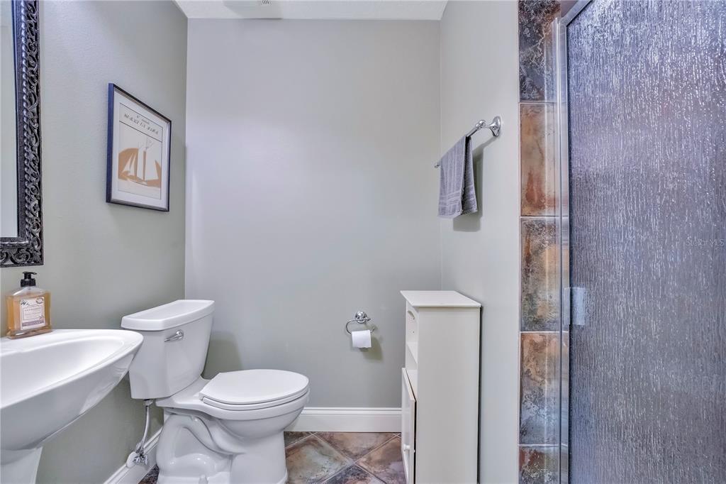 11450 Fangorn Road Orlando, FL 32825 - Photo 17 of 58 a white toilet sitting next to a bathroom sink