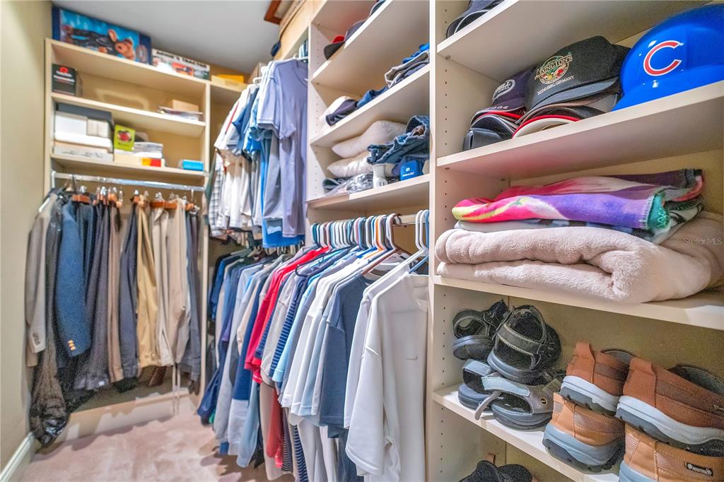 11450 Fangorn Road Orlando, FL 32825 - Photo 35 of 58 a view of walk in closet with clothes and shoes