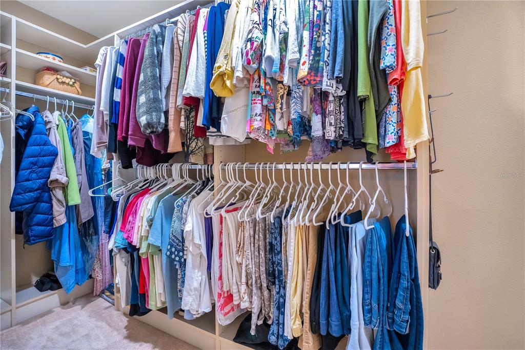 11450 Fangorn Road Orlando, FL 32825 - Photo 36 of 58 a view of walk in closet with clothes