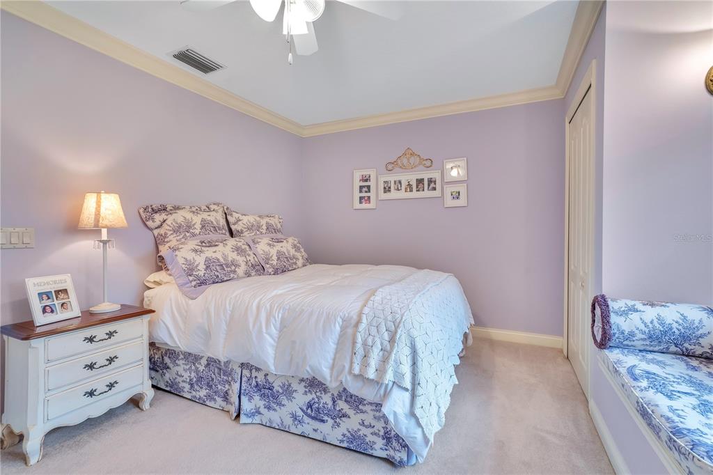 11450 Fangorn Road Orlando, FL 32825 - Photo 41 of 58 a bedroom with a bed and a lamp on dresser