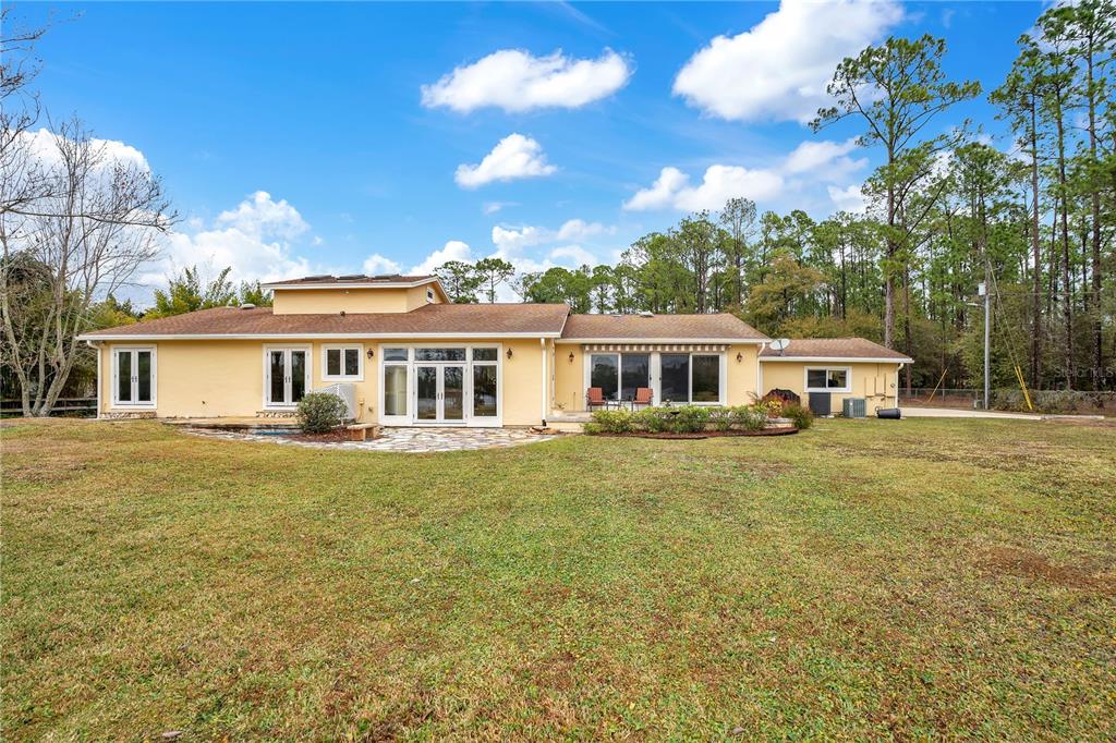 11450 Fangorn Road Orlando, FL 32825 - Photo 45 of 58 a front view of a house with a garden