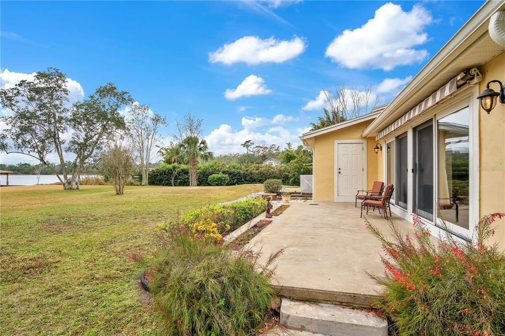 11450 Fangorn Road Orlando, FL 32825 - Photo 46 of 58 a view of house with yard and swimming pool