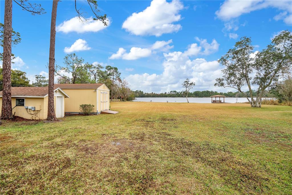 11450 Fangorn Road Orlando, FL 32825 - Photo 50 of 58 a view of an ocean with beach and house in the background