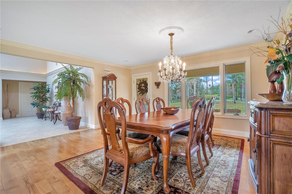 11450 Fangorn Road Orlando, FL 32825 - Photo 8 of 58 a view of a dining room with furniture window and wooden floor