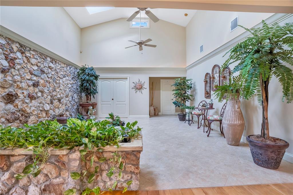 11450 Fangorn Road Orlando, FL 32825 - Photo 9 of 58 a living room with furniture and a potted plant
