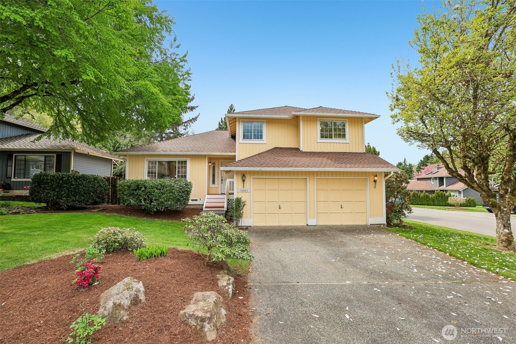 15601 160th Court Southeast Renton, WA 98058 - Photo 1 of 19 a front view of a house with a yard and garage