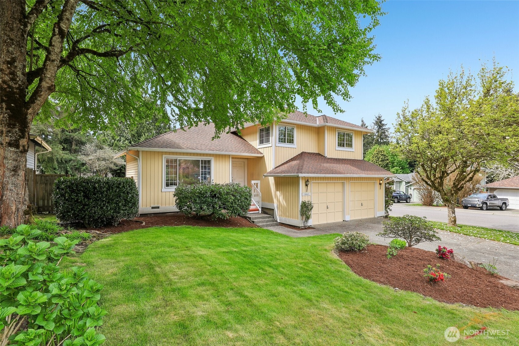 15601 160th Court Southeast Renton, WA 98058 - Photo 2 of 19 a front view of a house with a garden and yard