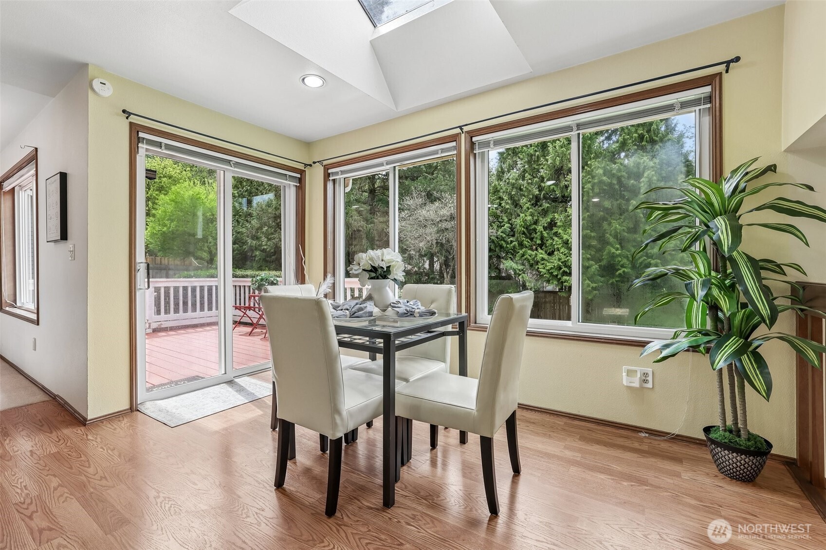 15601 160th Court Southeast Renton, WA 98058 - Photo 6 of 19 a dining room with furniture window and wooden floor