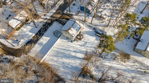 a backyard of a house with large trees