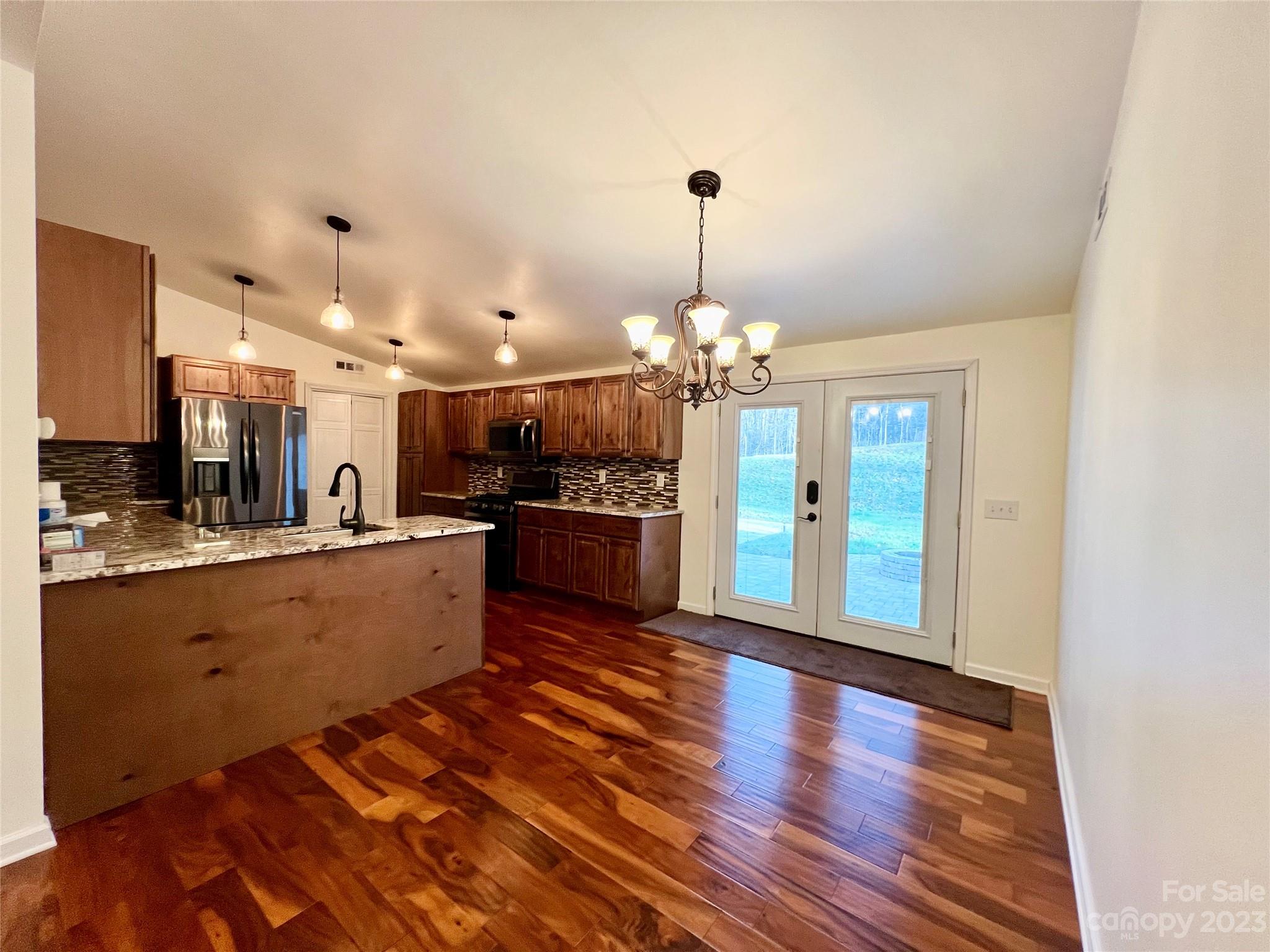3413 Cedar Circle Road Lancaster, SC 29720 - Photo 11 of 45 a large kitchen with granite countertop stainless steel appliances lots of counter space sink and cabinets