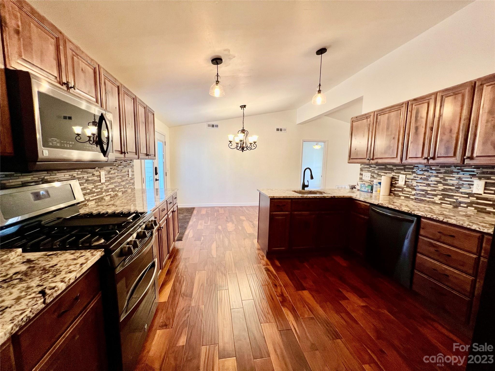 3413 Cedar Circle Road Lancaster, SC 29720 - Photo 14 of 45 a kitchen with a sink stove top oven and cabinets