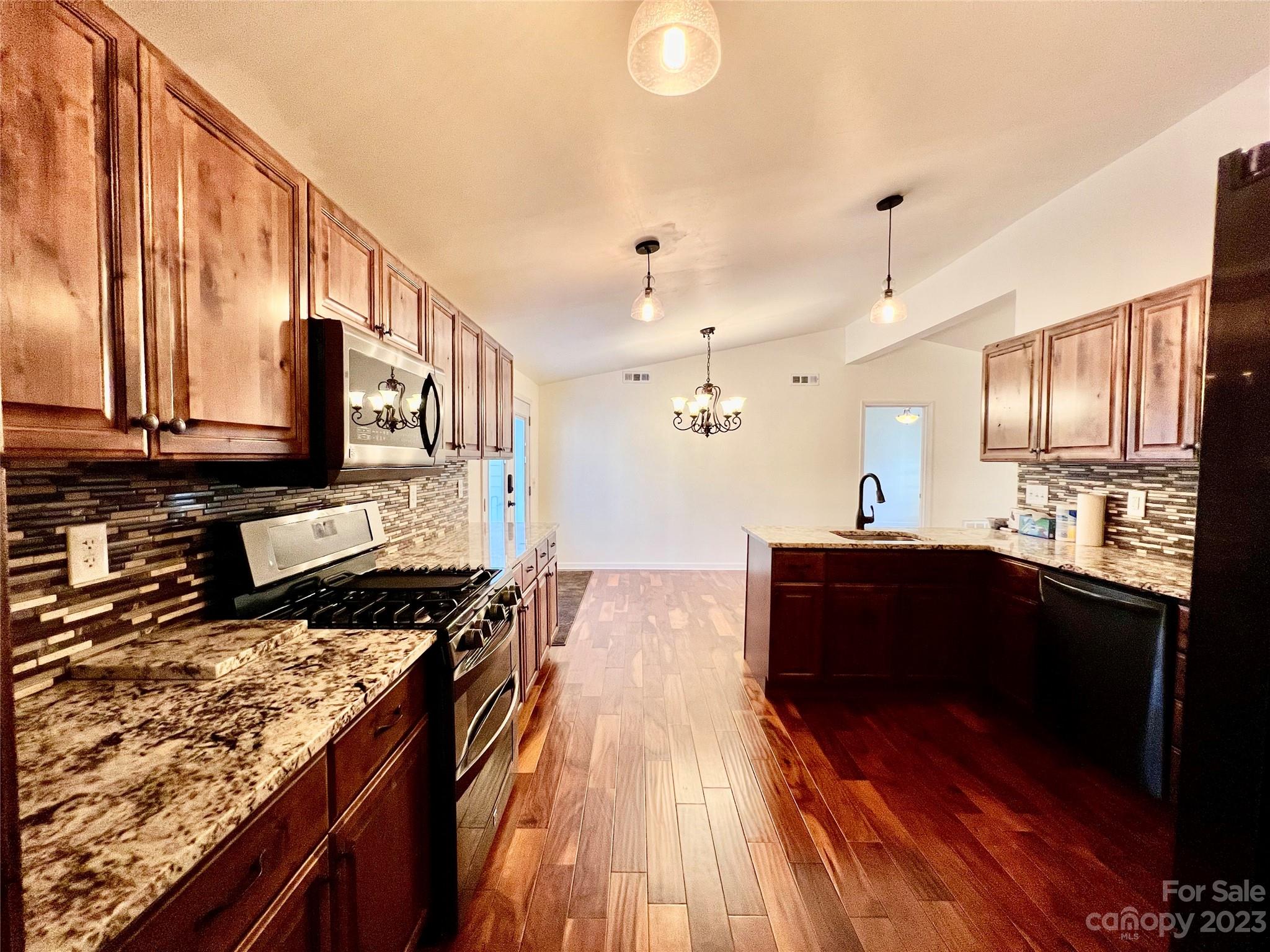 3413 Cedar Circle Road Lancaster, SC 29720 - Photo 15 of 45 a kitchen with stainless steel appliances granite countertop a stove and a sink