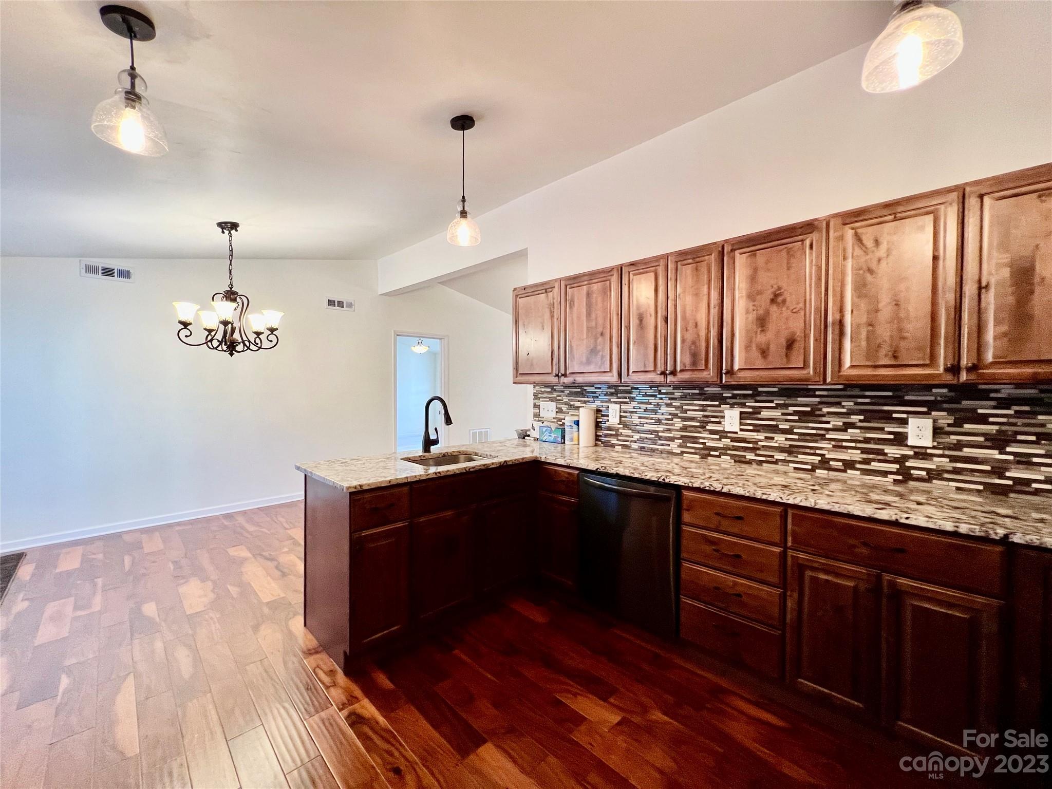 3413 Cedar Circle Road Lancaster, SC 29720 - Photo 17 of 45 a kitchen with wooden cabinets and sink