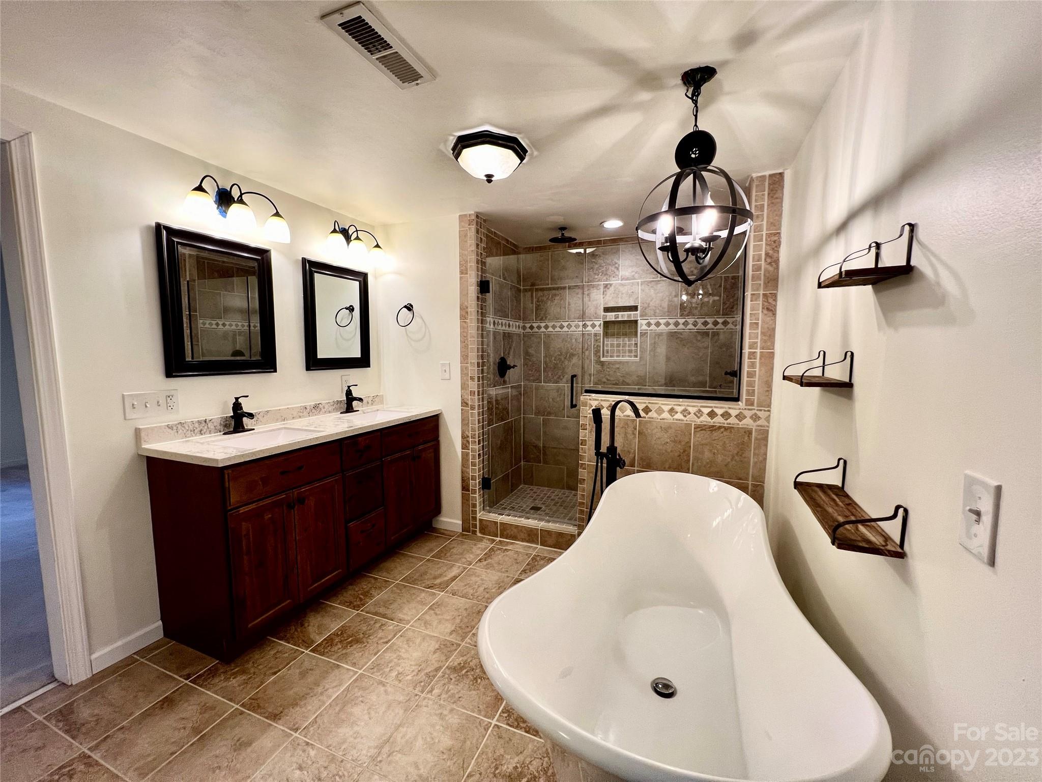3413 Cedar Circle Road Lancaster, SC 29720 - Photo 28 of 45 a spacious bathroom with a double vanity sink a mirror and bathtub