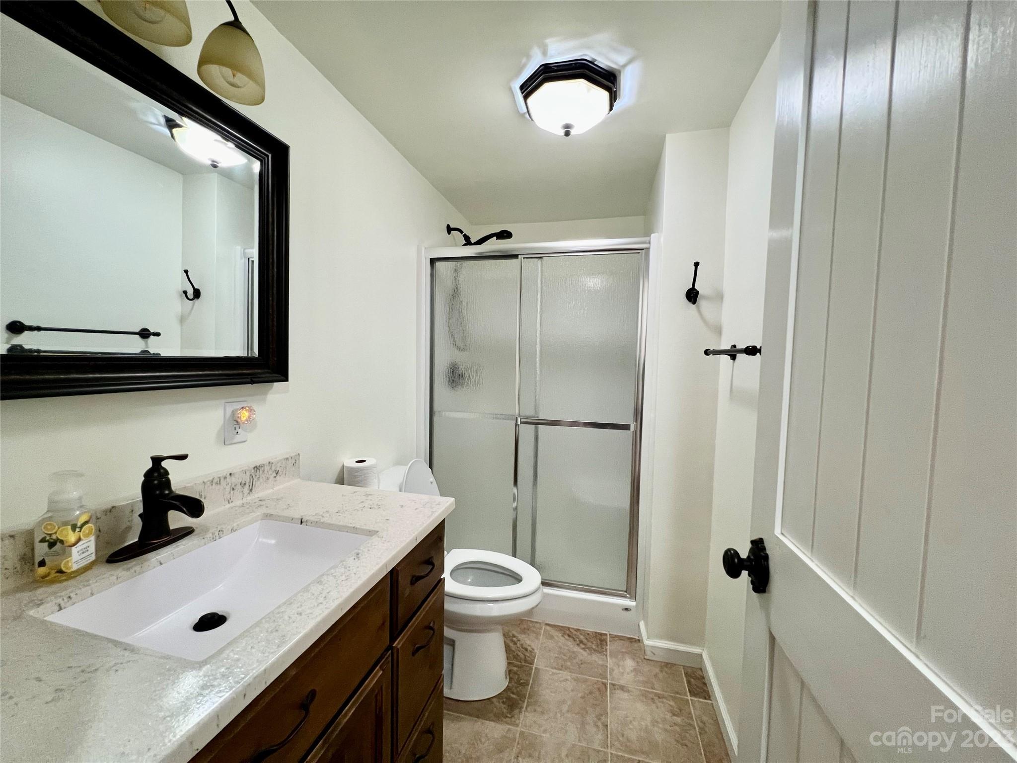 3413 Cedar Circle Road Lancaster, SC 29720 - Photo 34 of 45 a bathroom with a sink toilet and shower