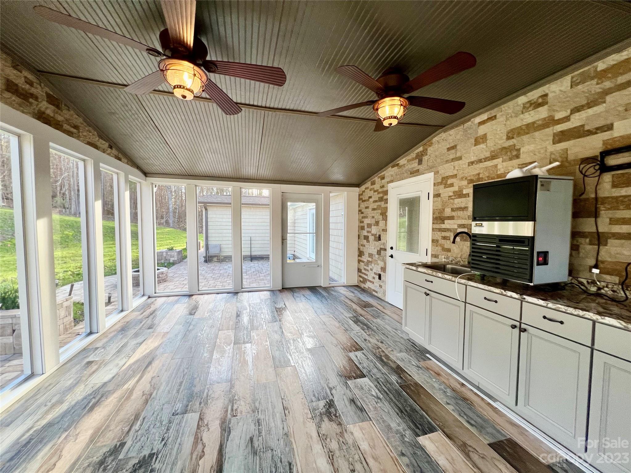 3413 Cedar Circle Road Lancaster, SC 29720 - Photo 37 of 45 a large kitchen with cabinets a sink and wooden floor