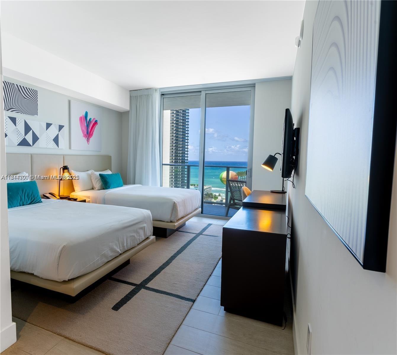 4010 South Ocean Drive, Unit R1905 Hollywood, FL 33019 - Photo 22 of 84 a bedroom with a bed and a dresser