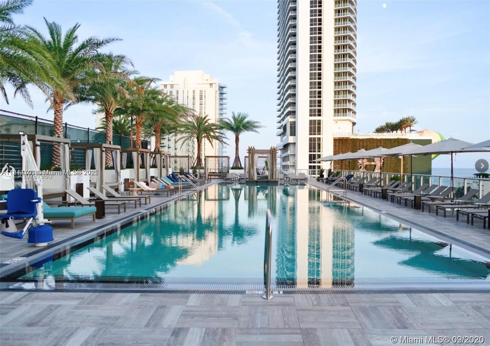 4010 South Ocean Drive, Unit R1905 Hollywood, FL 33019 - Photo 70 of 84 a view of swimming pool with outdoor seating and lake view