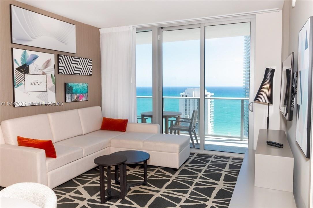 4010 South Ocean Drive, Unit R1905 Hollywood, FL 33019 - Photo 10 of 84 a living room with furniture and a window