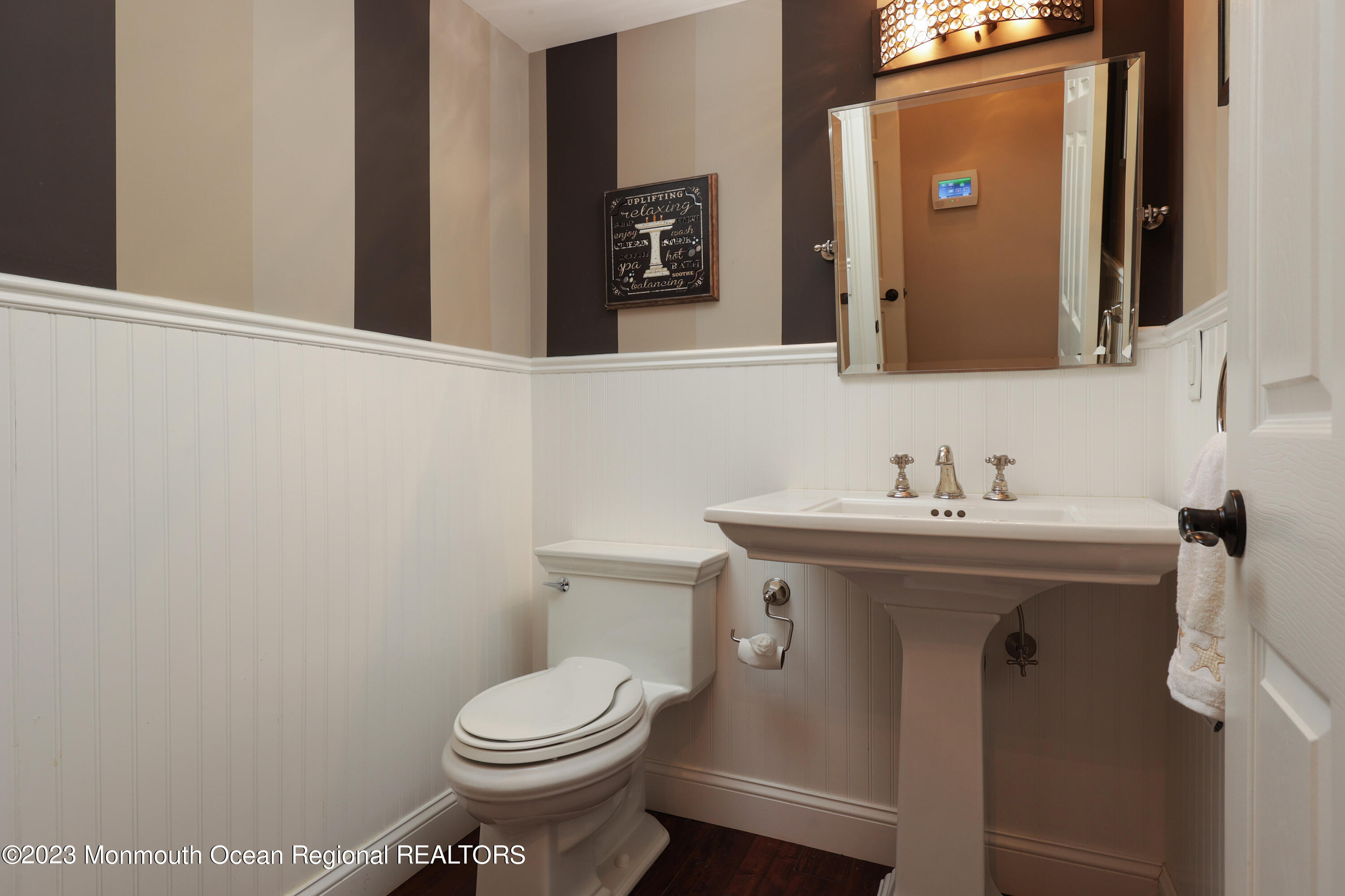 10 Halsey Drive Brick, NJ 08723 - Photo 16 of 46 a bathroom with a sink toilet and mirror