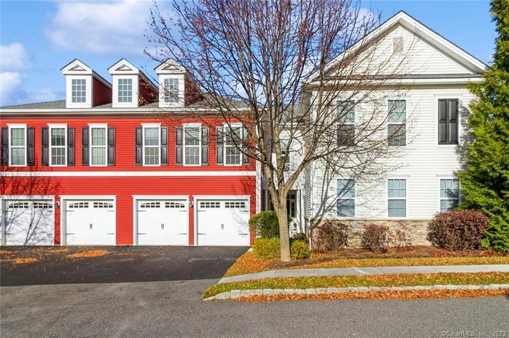 21 Mill Road, Unit 21 Danbury, CT 06810 - Photo 1 of 1 a front view of a house with a yard