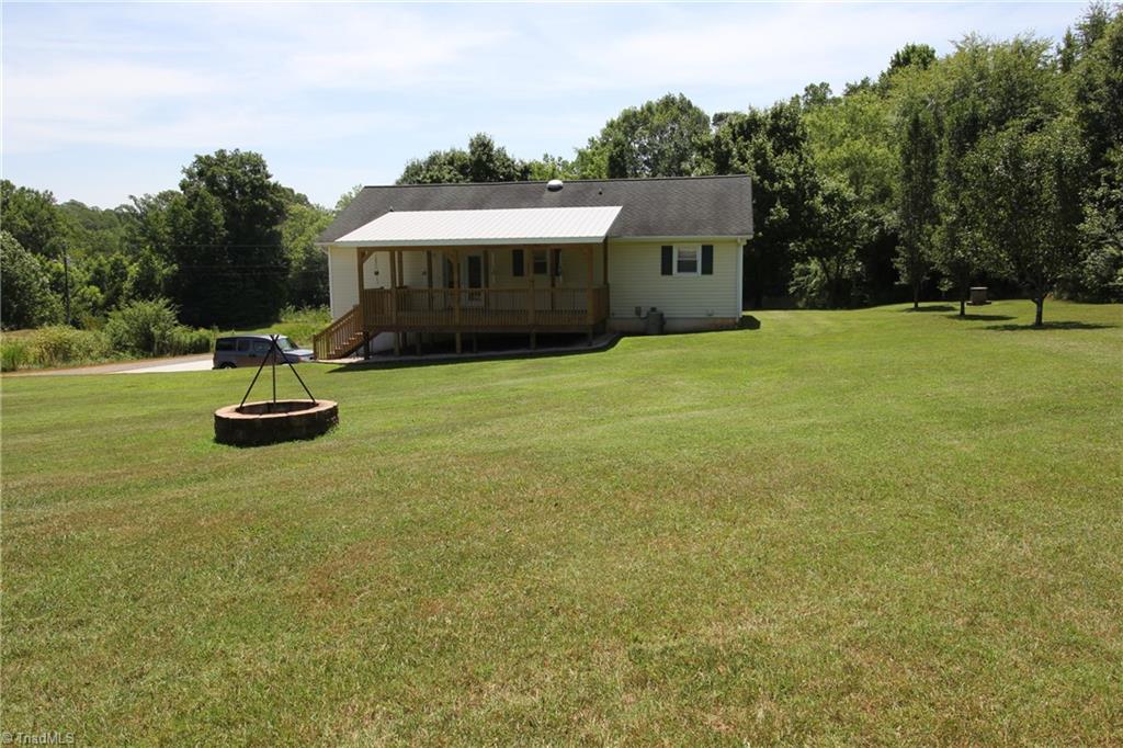 1164 County Home Road Mocksville, NC 27028 - Photo 10 of 18 Fire pit in back of home. Lots of privacy here, just under 5 acres.