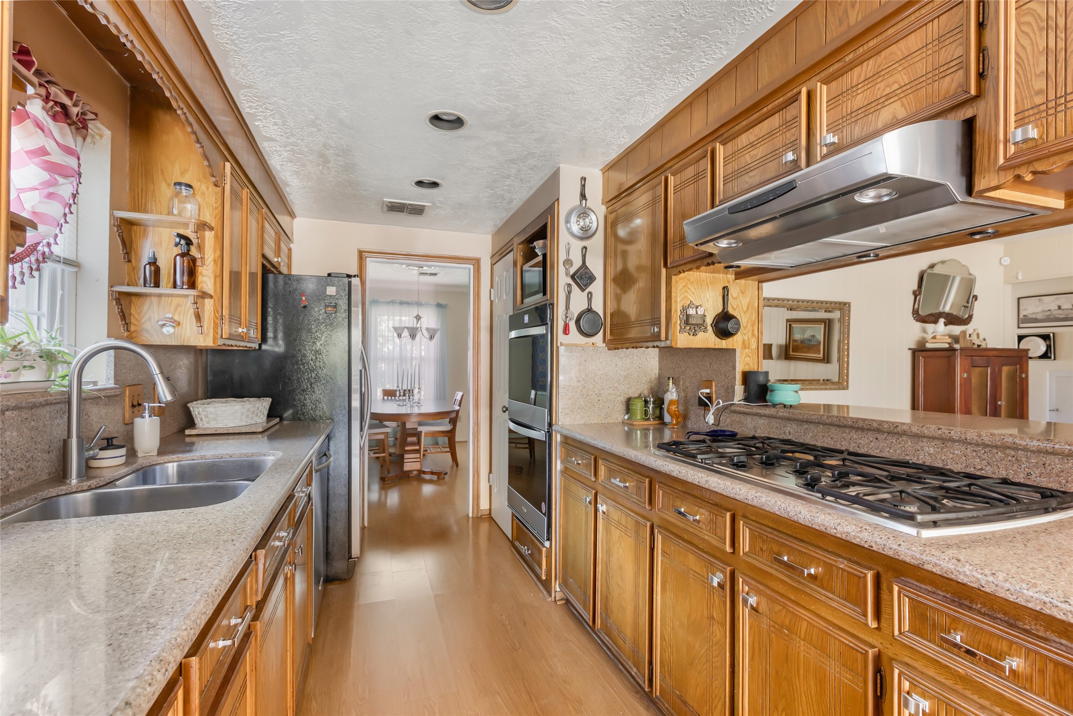 14510 Foxford Way Houston, TX 77015 - Photo 12 of 37 a kitchen with stainless steel appliances granite countertop a stove and a sink