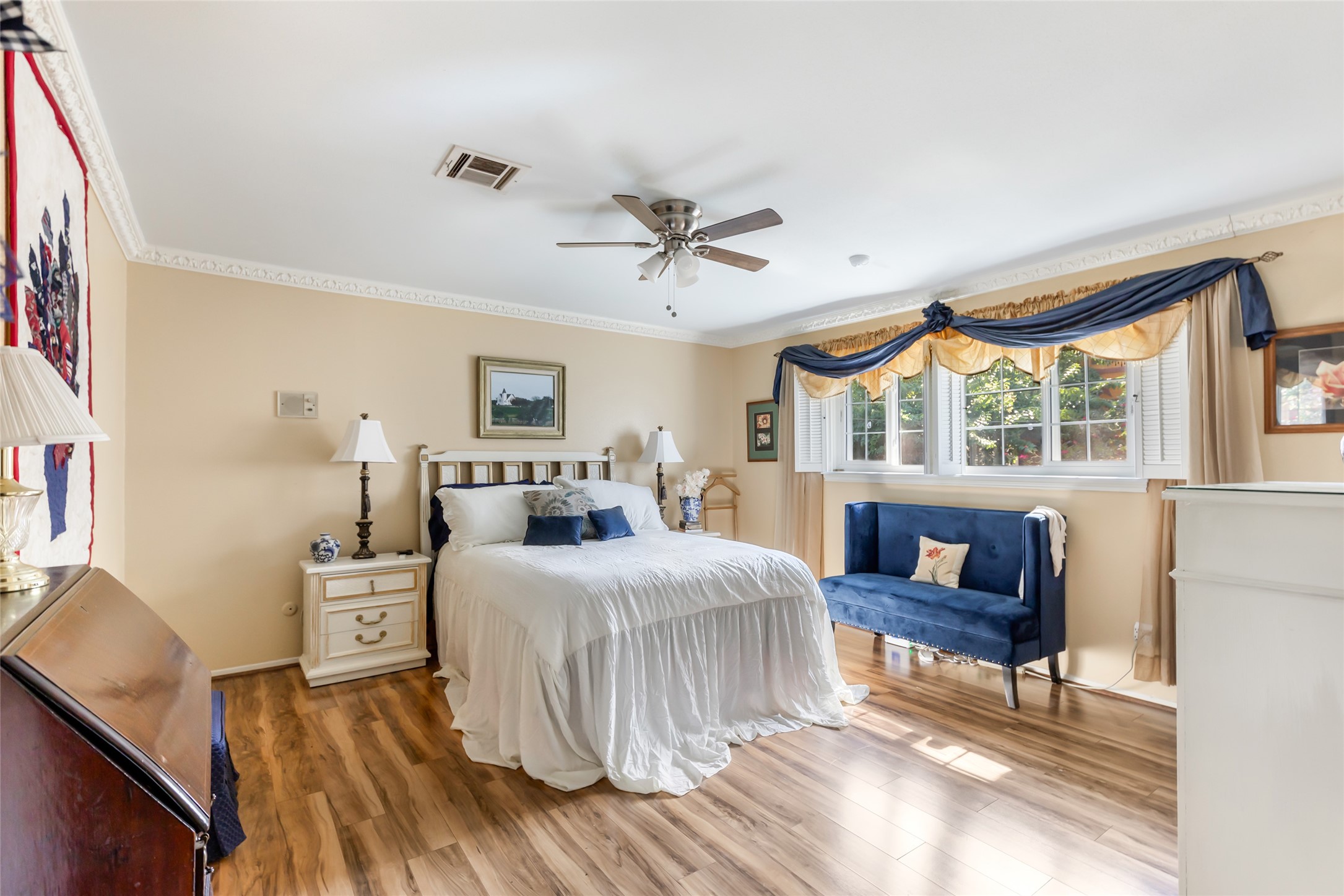 14510 Foxford Way Houston, TX 77015 - Photo 19 of 37 a bedroom with a bed and wooden floor