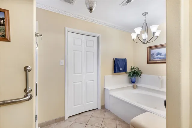 a bathroom with a bathtub and shower