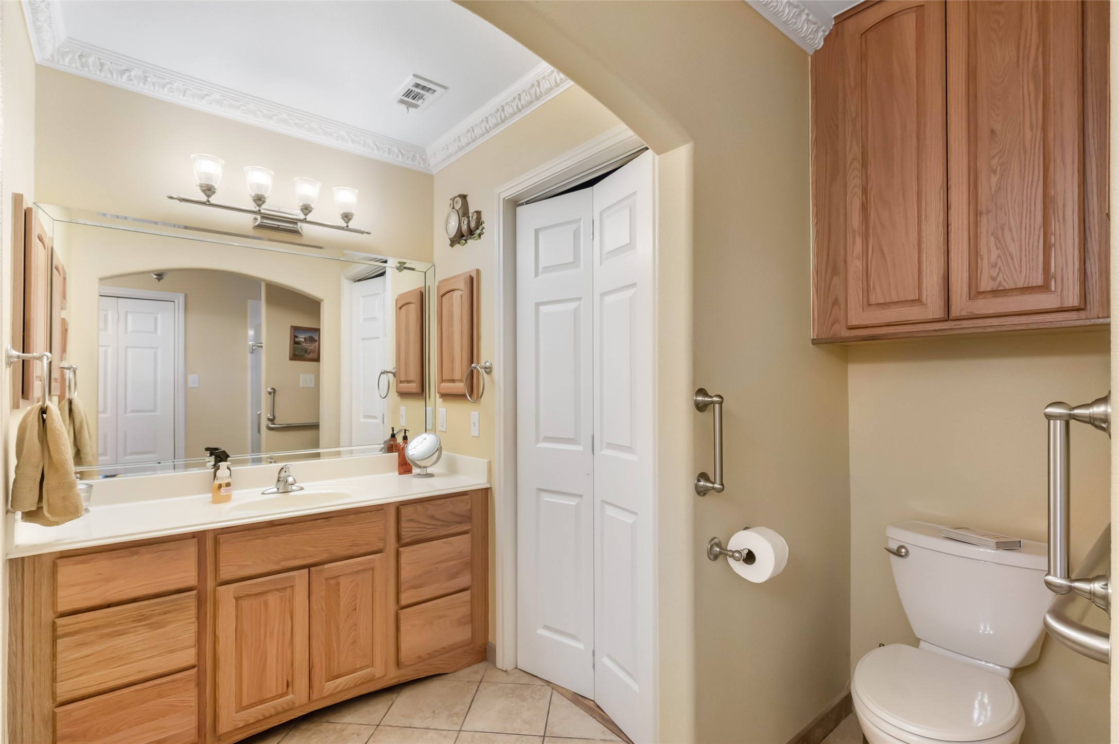 14510 Foxford Way Houston, TX 77015 - Photo 24 of 37 a spacious bathroom with a double vanity sink a toilet and a mirror
