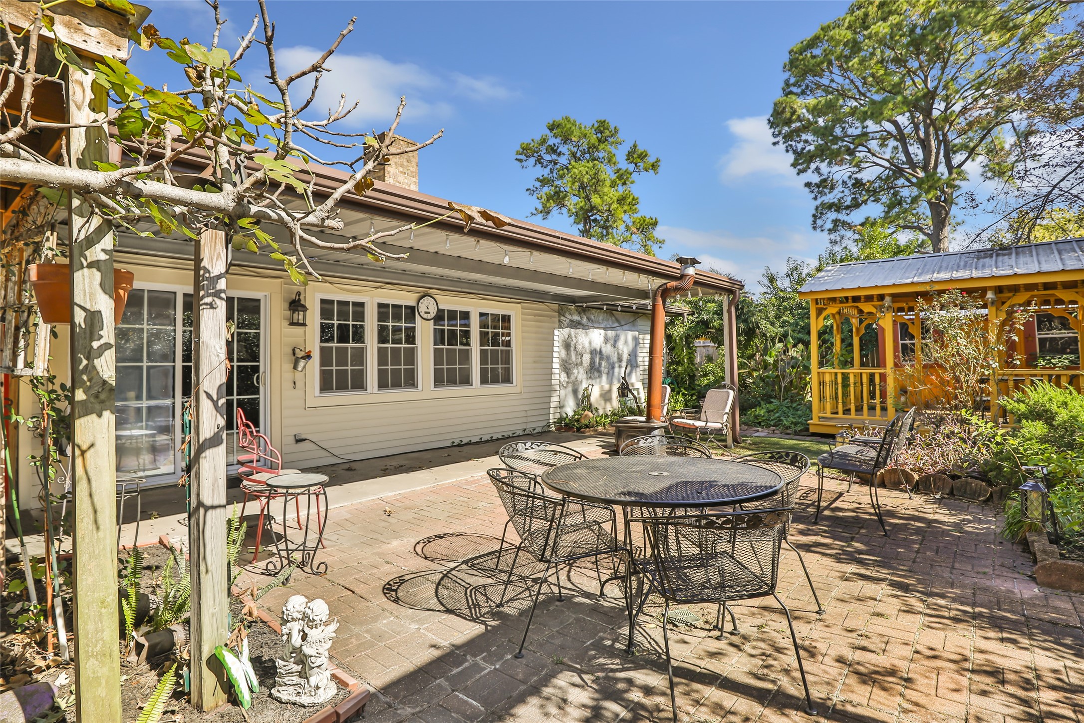 14510 Foxford Way Houston, TX 77015 - Photo 33 of 37 a view of a patio with table and chairs and potted plants