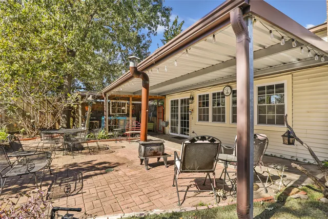 a backyard of a house with outdoor seating