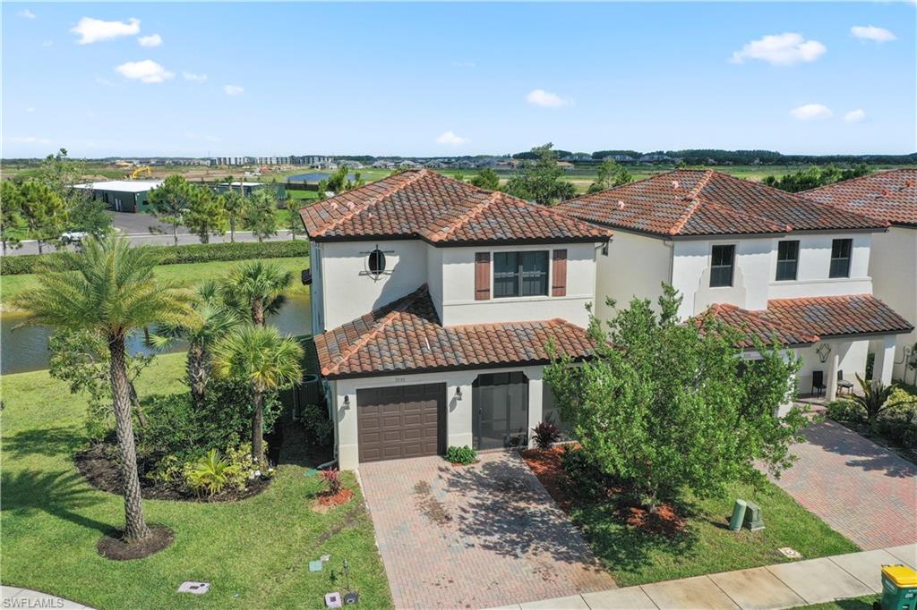5595 Useppa Drive Ave Maria, FL 34142 - Photo 2 of 13 a front view of a house with a yard