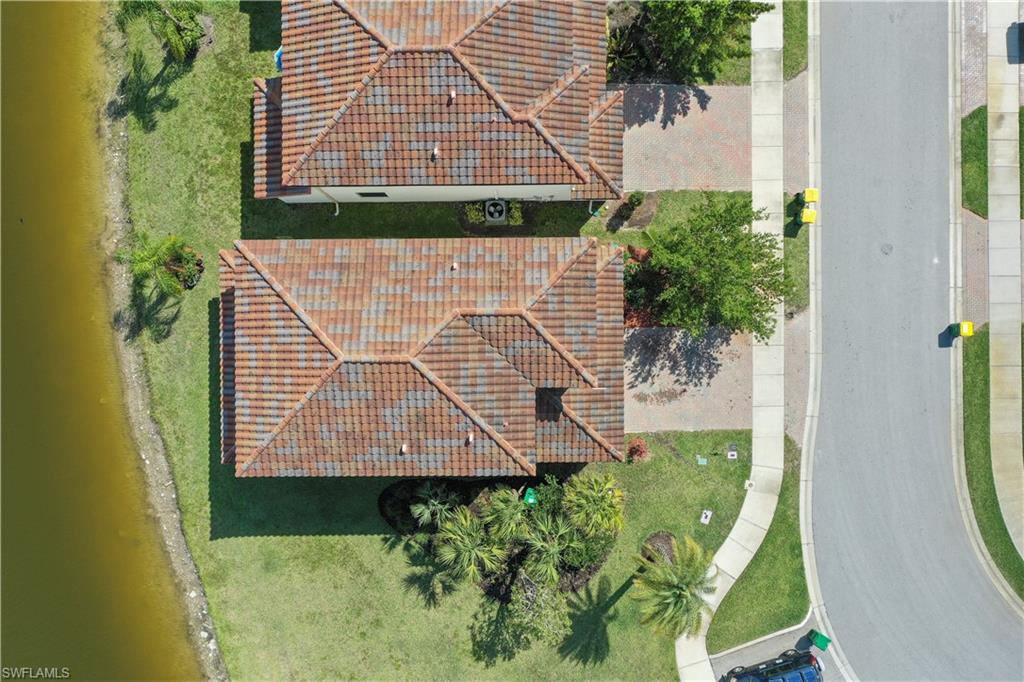 5595 Useppa Drive Ave Maria, FL 34142 - Photo 3 of 13 a view of house with a yard