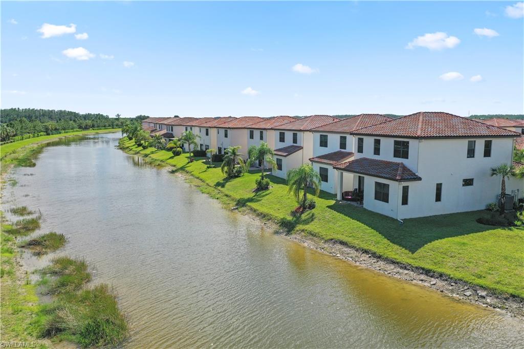 5595 Useppa Drive Ave Maria, FL 34142 - Photo 7 of 13 a house with river in front of it