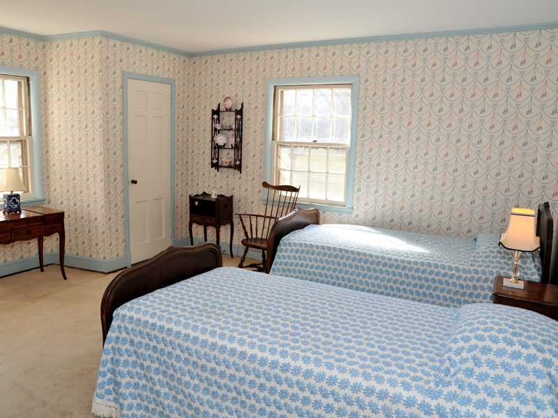 235 North Maple Avenue Greenwich, CT 06830 - Photo 16 of 19 a bedroom with a bed and a lamp