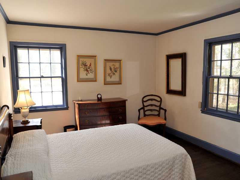 235 North Maple Avenue Greenwich, CT 06830 - Photo 17 of 19 a bedroom with a bed and a window