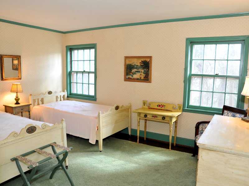 235 North Maple Avenue Greenwich, CT 06830 - Photo 18 of 19 a bedroom with a bed and a window