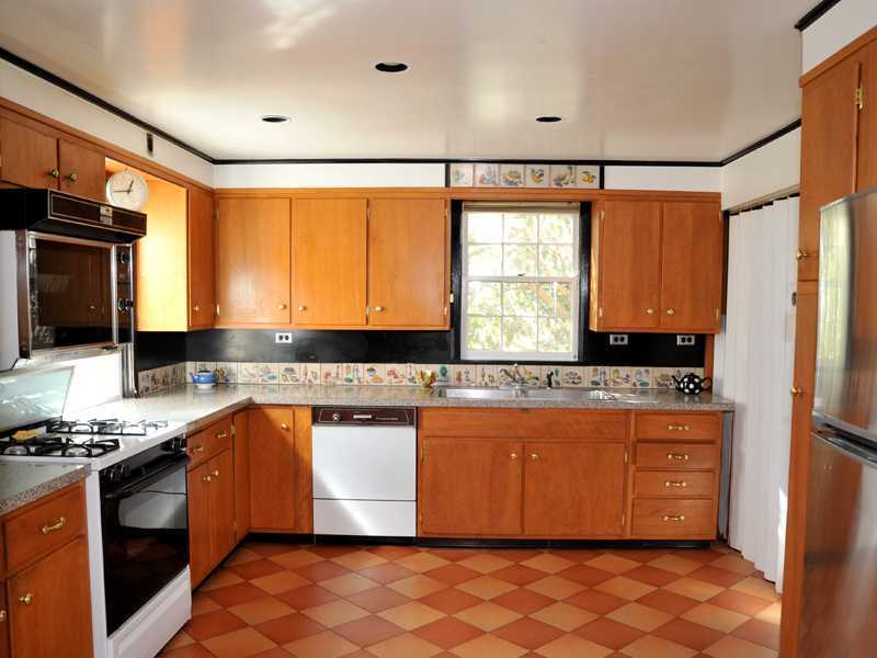 235 North Maple Avenue Greenwich, CT 06830 - Photo 10 of 19 a kitchen with stainless steel appliances granite countertop a stove a sink and a microwave