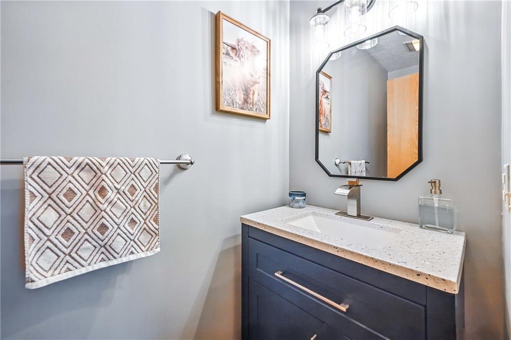 723 Rollinson Road Hermitage, PA 16148 - Photo 15 of 38 a bathroom with a sink and a mirror