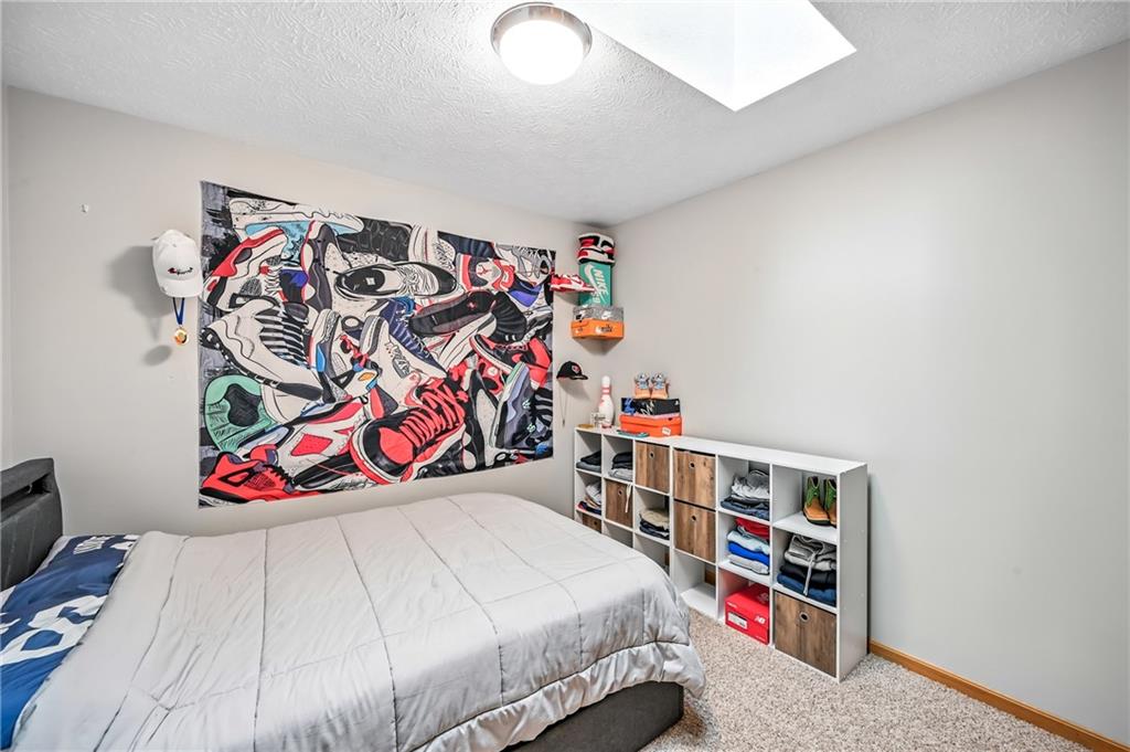 723 Rollinson Road Hermitage, PA 16148 - Photo 19 of 38 a bedroom with bed and a white cabinet