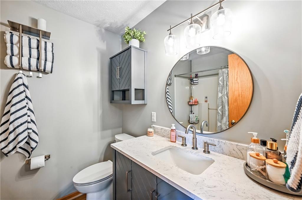 723 Rollinson Road Hermitage, PA 16148 - Photo 26 of 38 a bathroom with a sink vanity mirror and toilet
