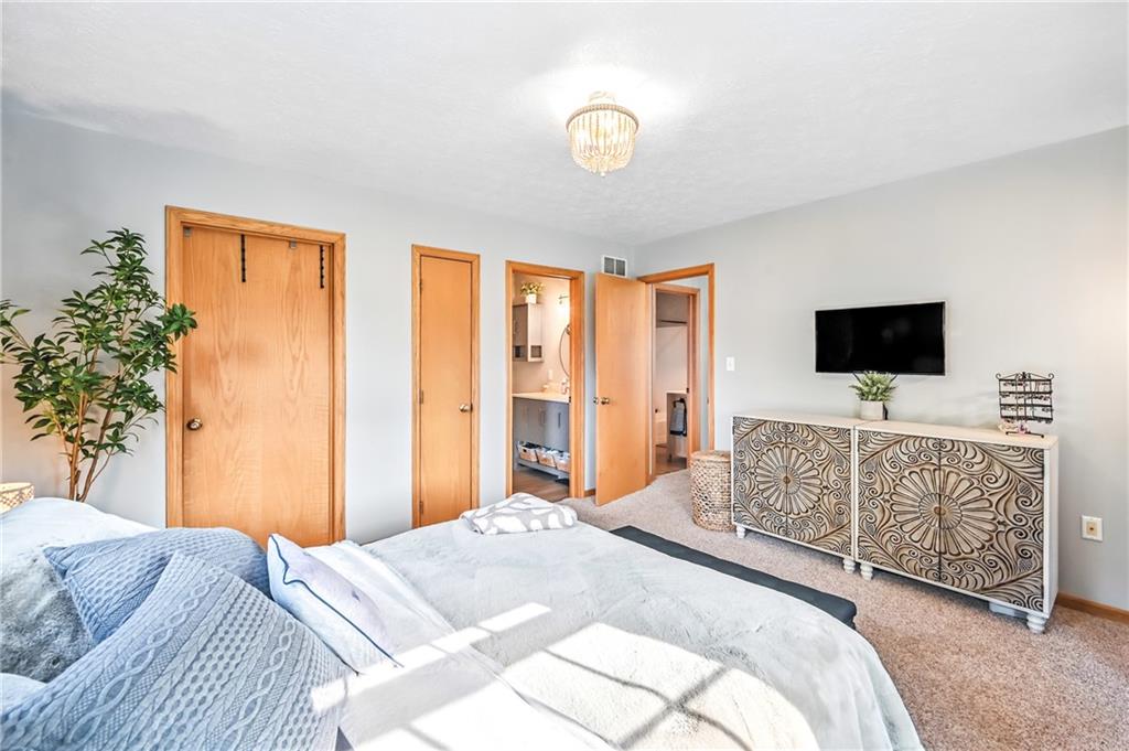 723 Rollinson Road Hermitage, PA 16148 - Photo 27 of 38 a bedroom with a bed and flat screen tv